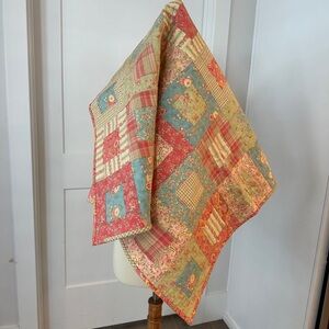 Handmade quilted baby blanket.